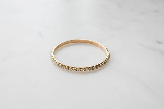 Gold bangle bracelet studded with jewels