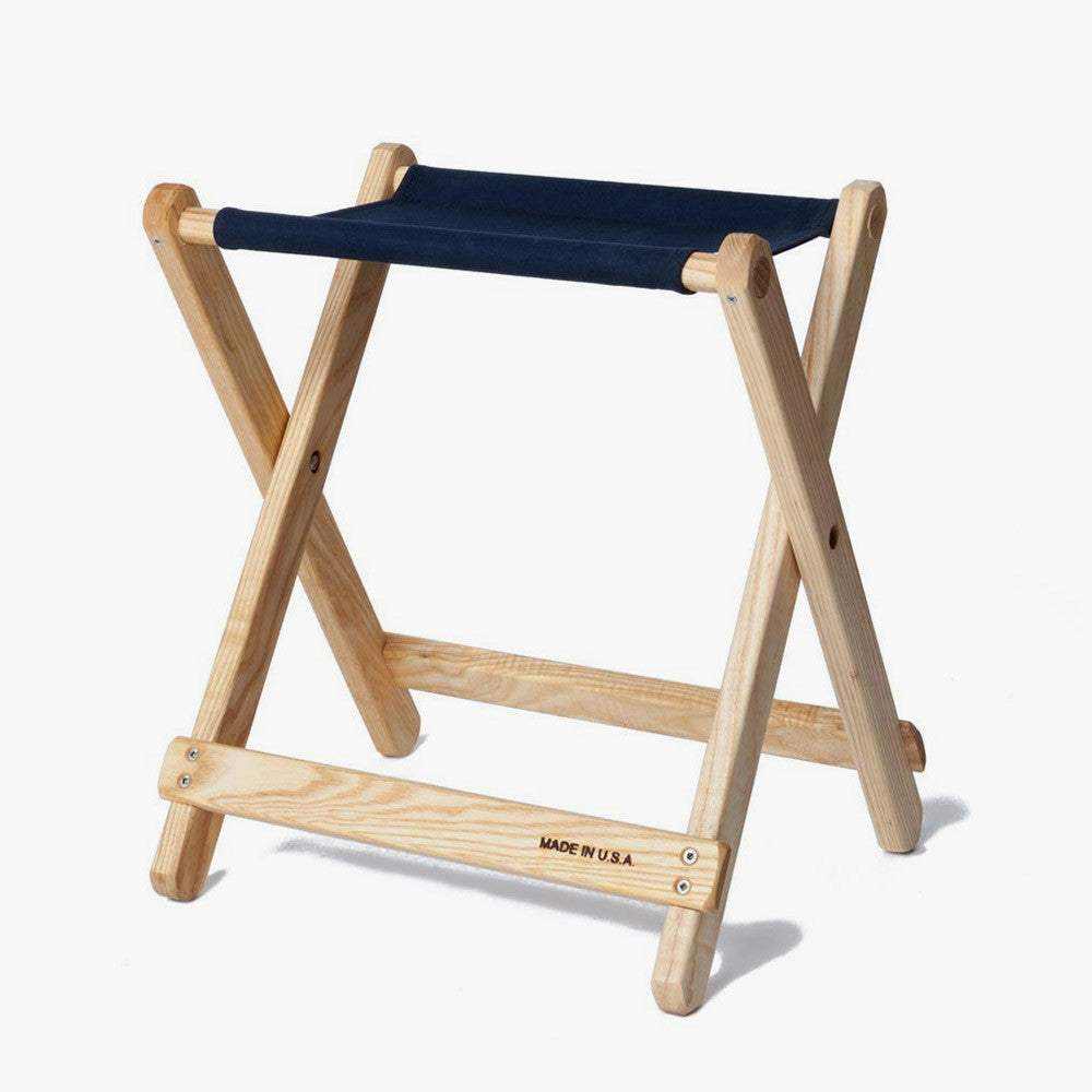 Foldable Camp Stool with navy blue canvas seat and hardwood frame handcrafted in the USA