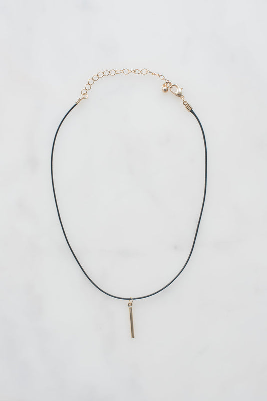 Black leather choker necklace with 14k yellow gold pendant and lobster clasp, made in USA.