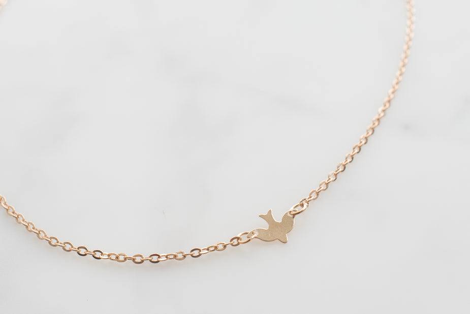 14k gold bird necklace with delicate double chains