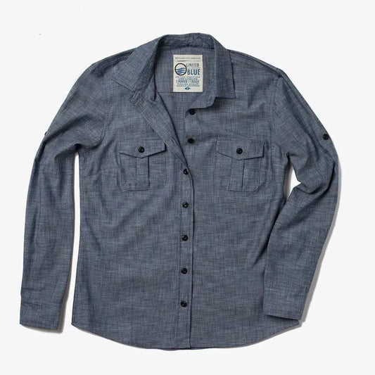 Woman wearing 100% organic cotton chambray shirt with natural Corozo buttons from United By Blue