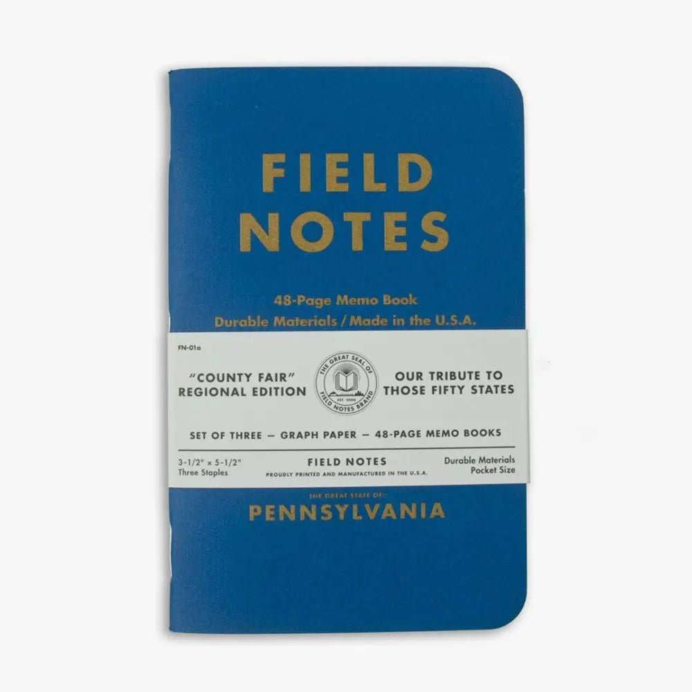 Three Pennsylvania Notebooks with linen covers and metallic gold printing in blue, red, and yellow colors featuring state facts