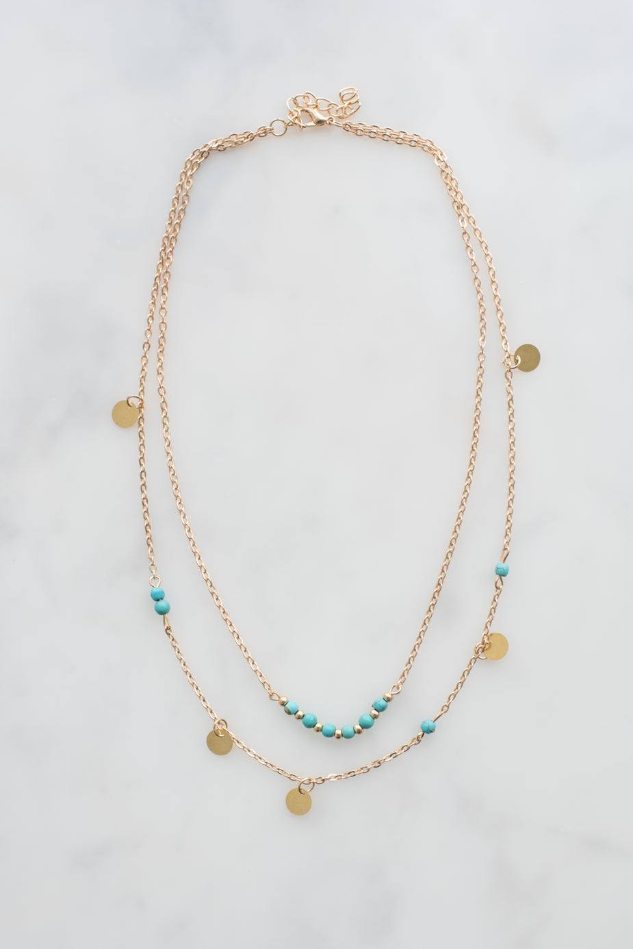 Pretty gold necklace with turquoise beads and double chain pendant design in 14k gold