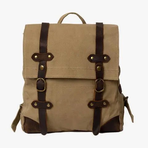 Durable Scout Backpack with adjustable straps, waxed canvas, leather accents, and snap-button closure